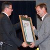 Surf Ranch official Blake Hess accepts the Lemoore Chamber of Commerce Business of the Year Award.